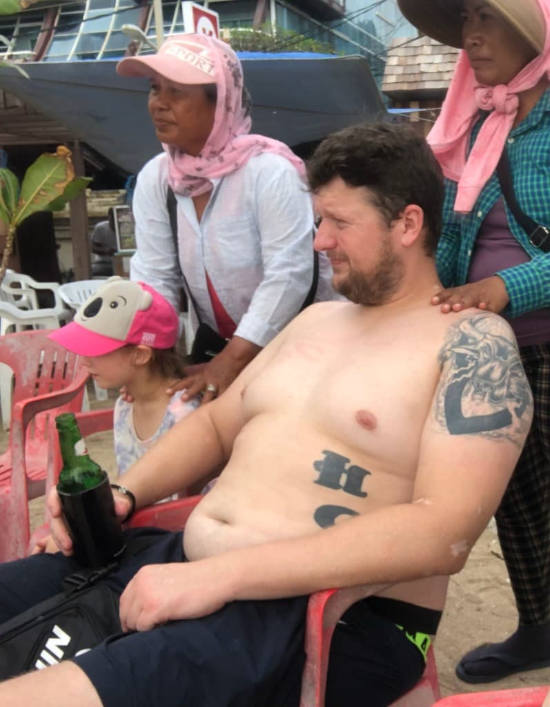 Blake on holiday, mid-drink, before the shift